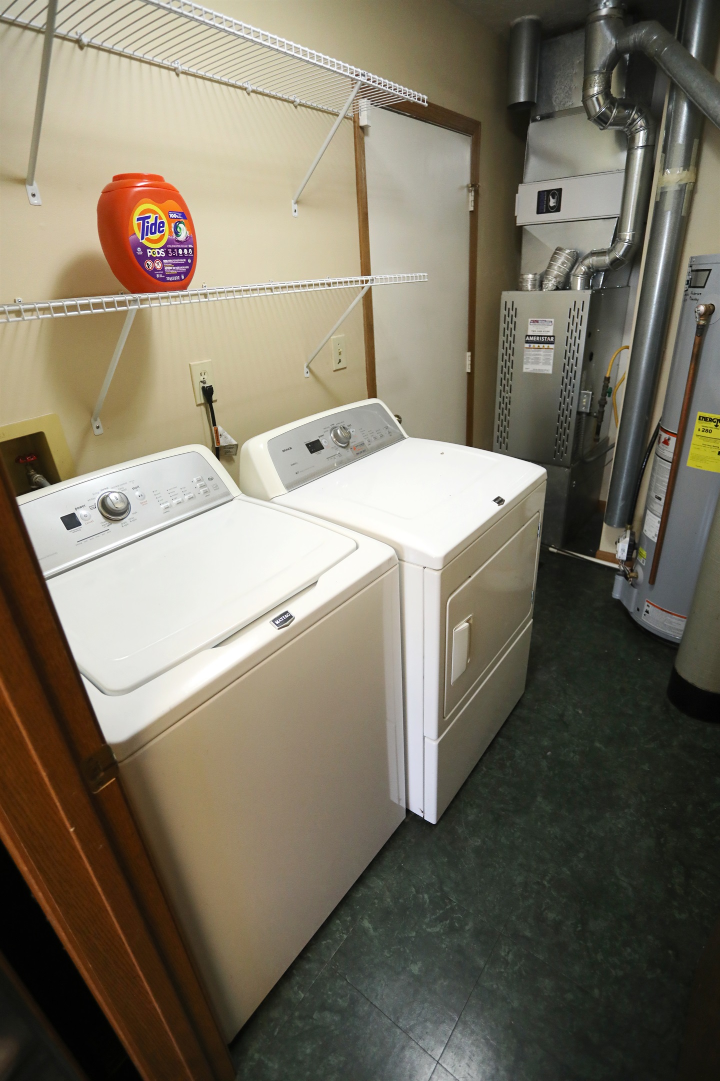 Laundry room top loaded washer and front loaded dryerdryer