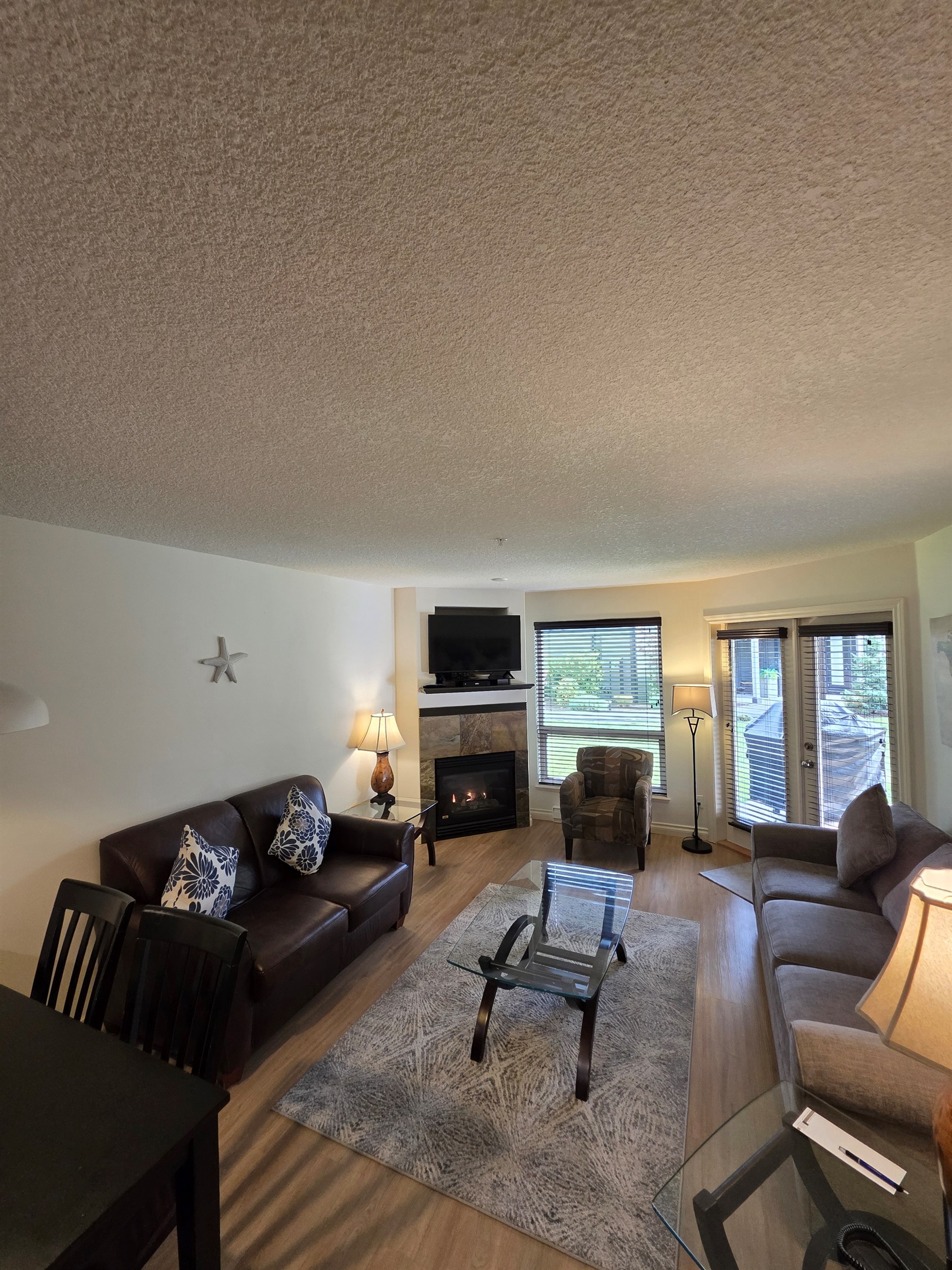 Unit A Living room area. Natural gas fireplace. Streaming TV. Double glass doors to private covered patio.