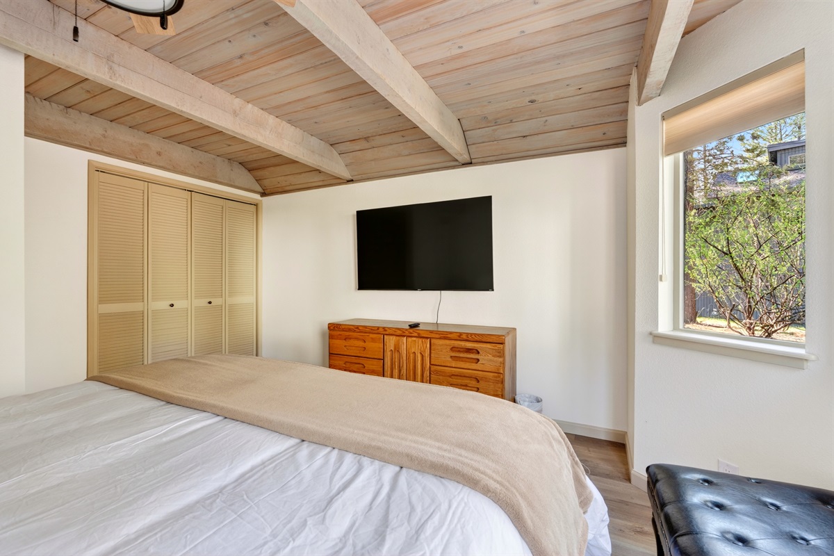 Bedroom 1 features a comfortable king bed and Smart TV, creating a relaxing retreat to unwind after a day in Sunriver.