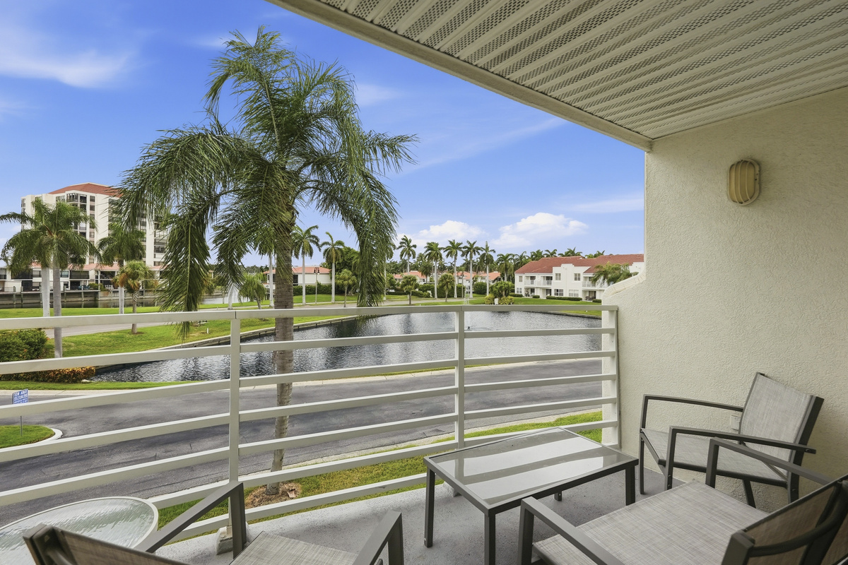 Step outside onto your private balcony and take in peaceful views of the water and the surrounding neighborhood. It's the perfect spot to enjoy your morning coffee, unwind with an evening drink, or simply soak in the beautiful Florida scenery.