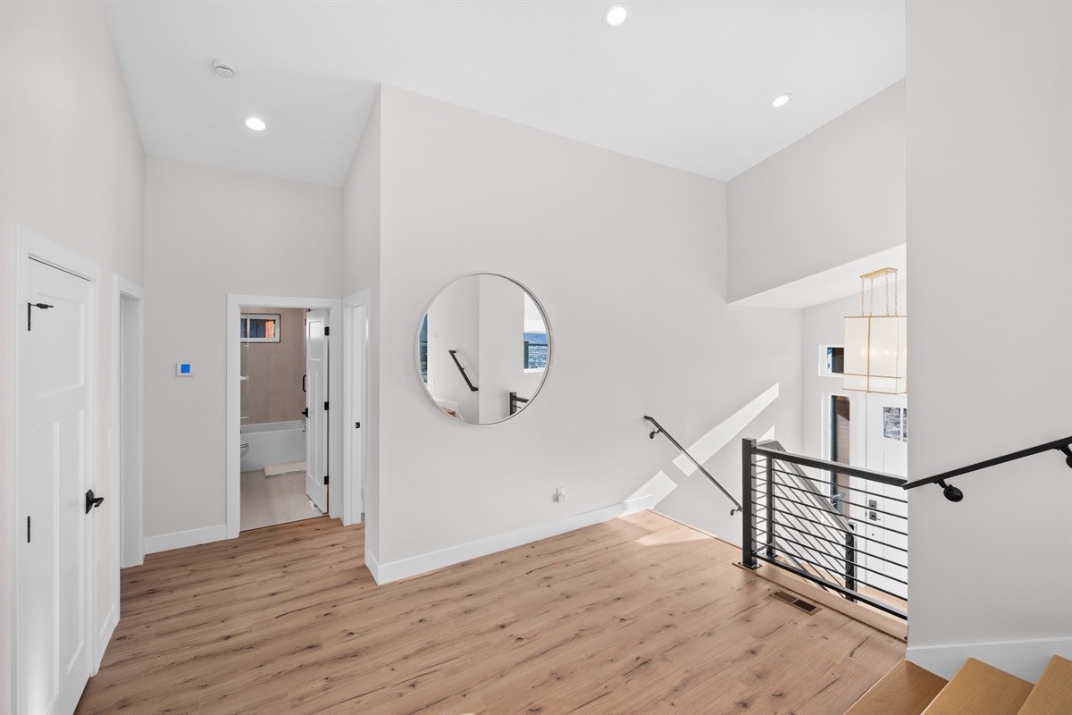 Open stairway and landing area with clean modern finishes and natural light.