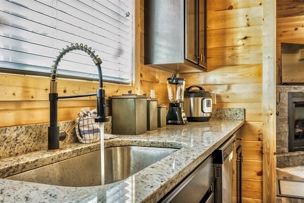 Artfully decorated kitchen with a complete suite of culinary tools, including a slow cooker and blender, for memorable meals.