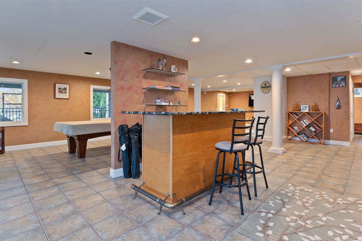 Lower level living room with bar and pool table
