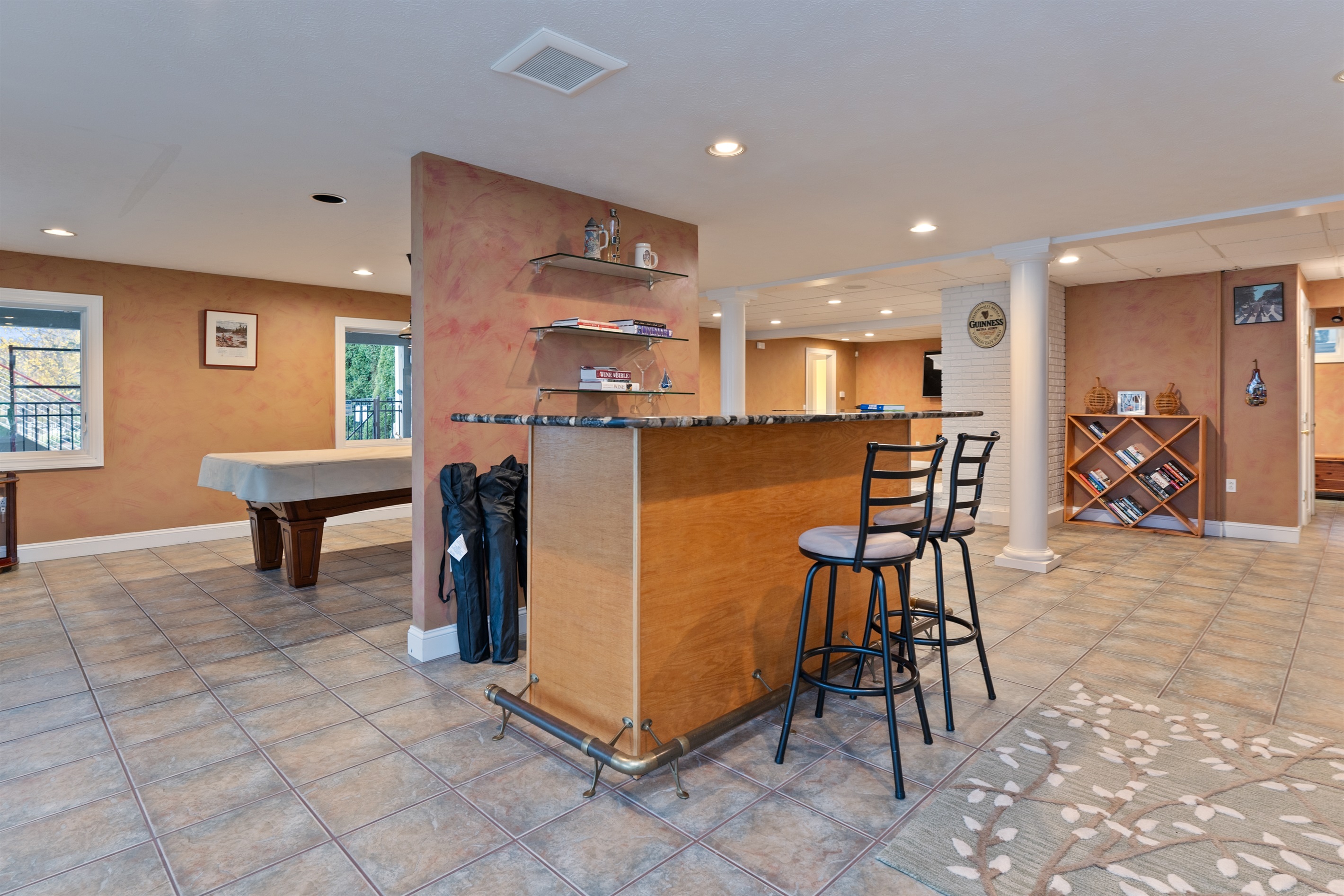 Lower level living room with bar and pool table