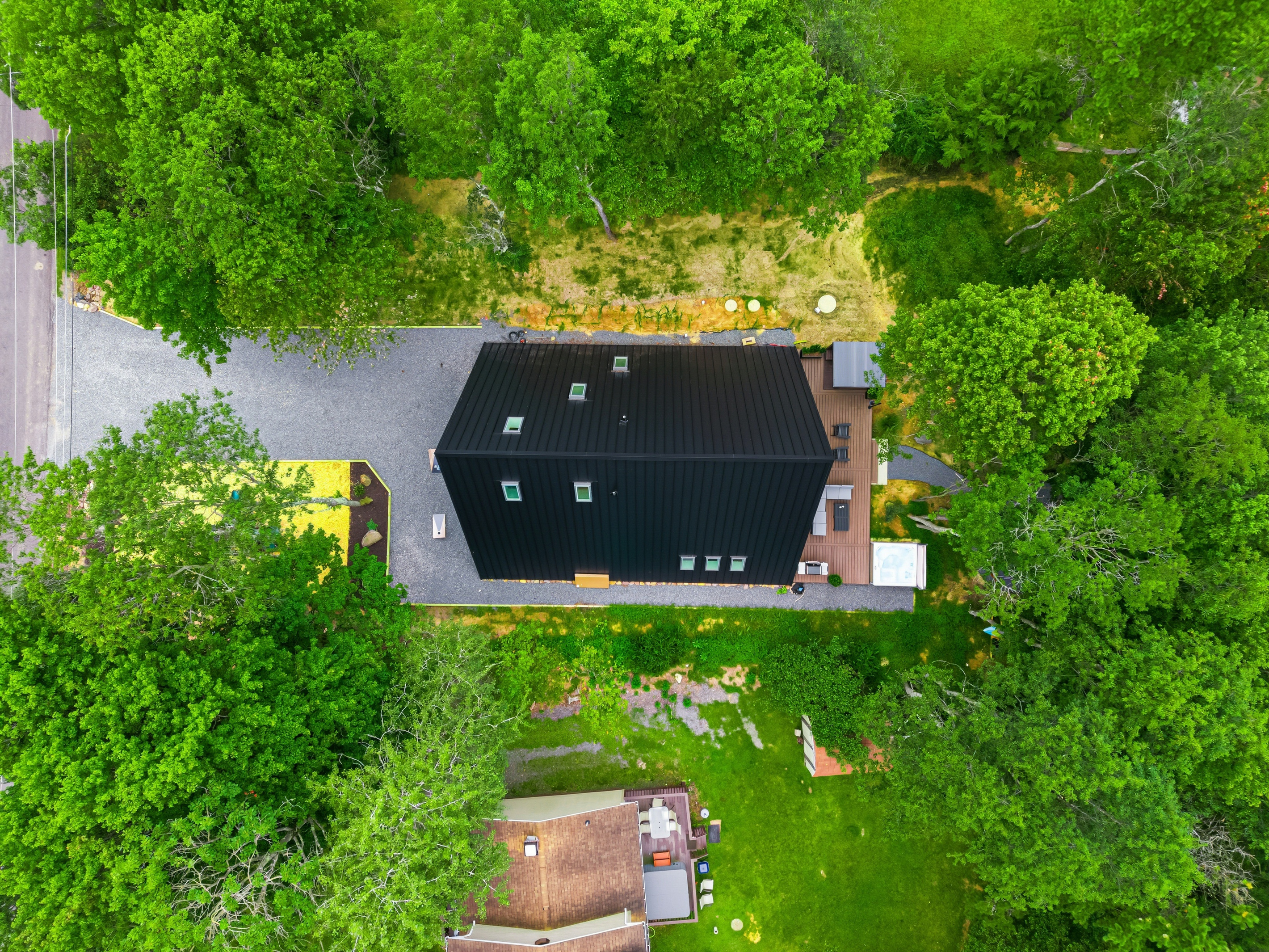 Black roof in a green canopy