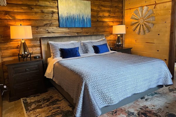 Primary bedroom with king bed and ensuite soaking tub / bath—cozy, quiet, and private.