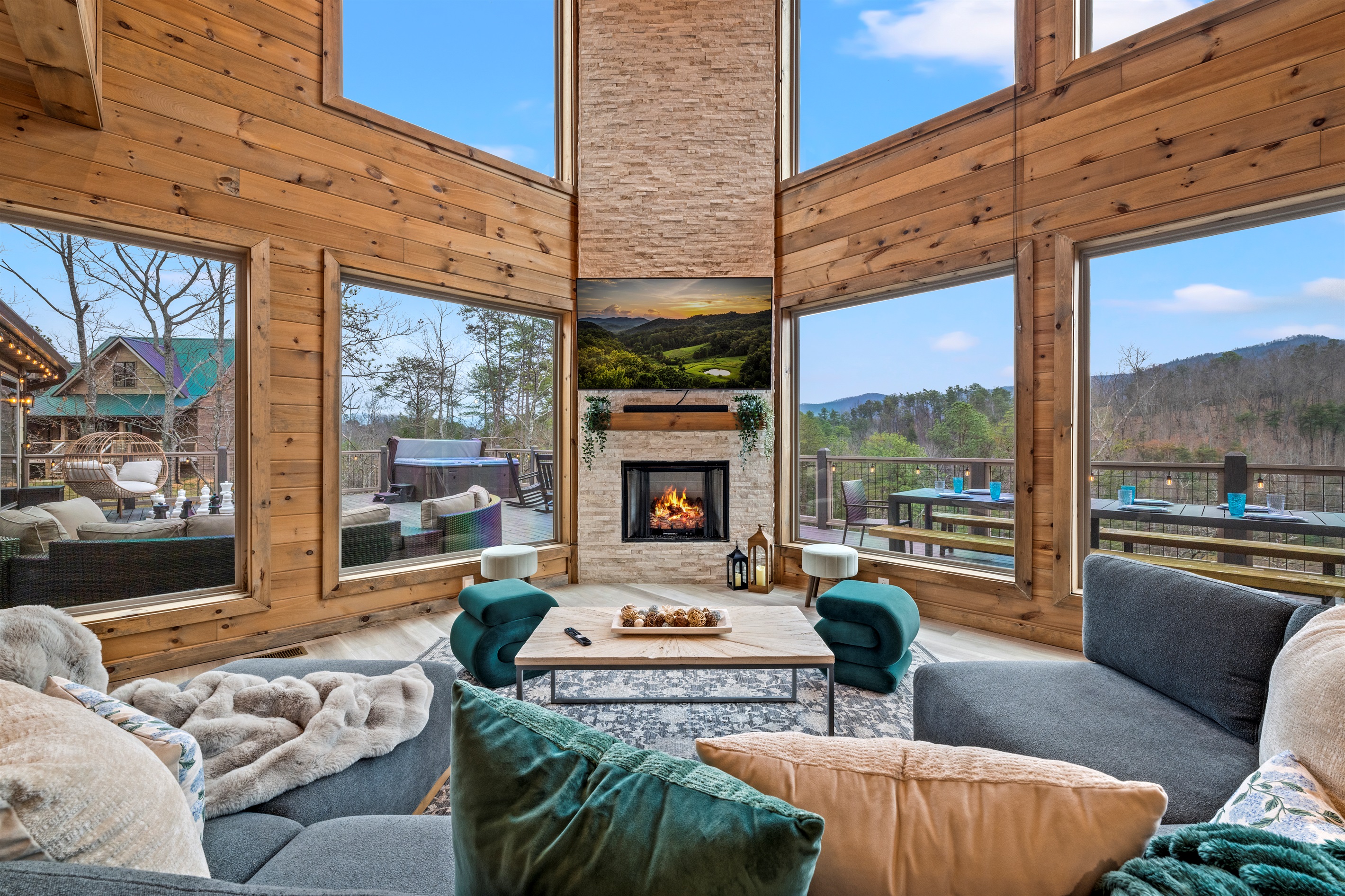 You will love the living room, where a wall of windows brings the mountains inside and creates a warm gathering space around the TV & fireplace with views on every side, making it the natural place everyone comes together throughout the stay.