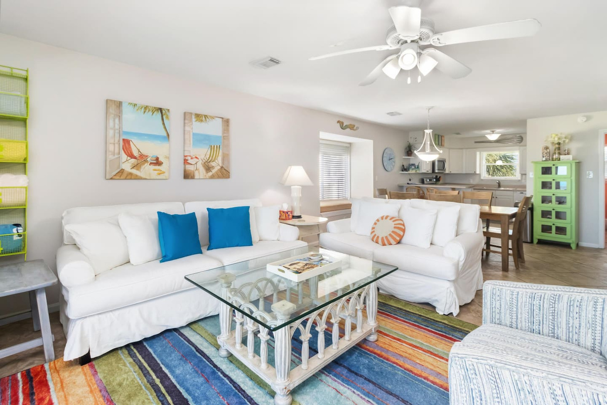 Find a second angle on the living room and the Gulf views keep showing up &mdash; there's no bad seat in this space.