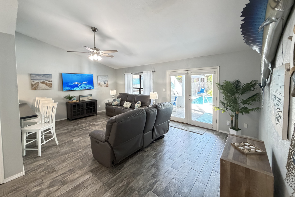 Living area with view of pool area