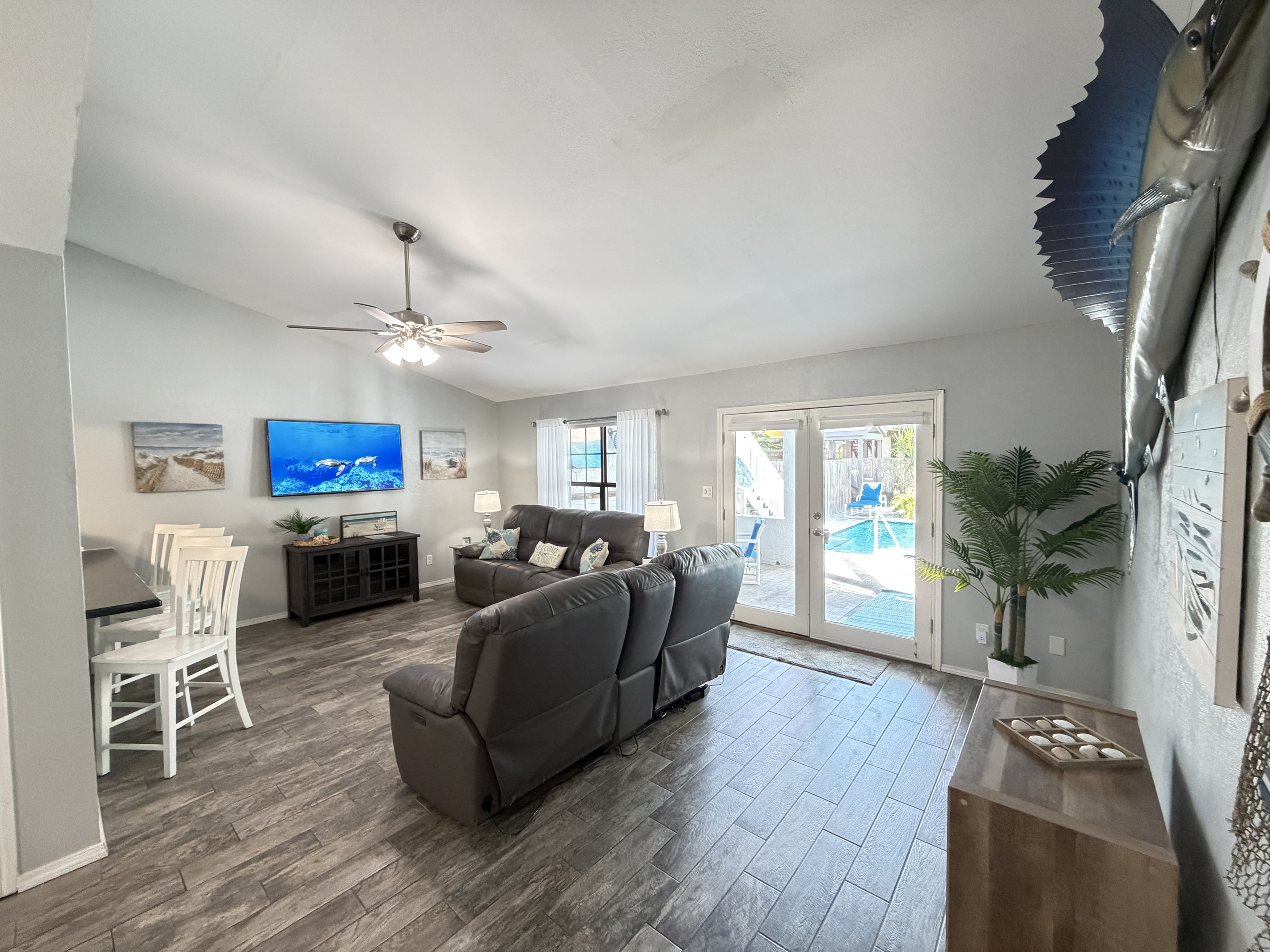 Living area with view of pool area