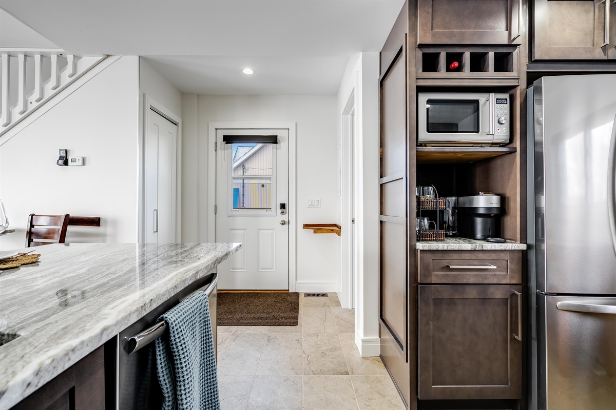 Streamlined cabinetry blends white and natural oak.