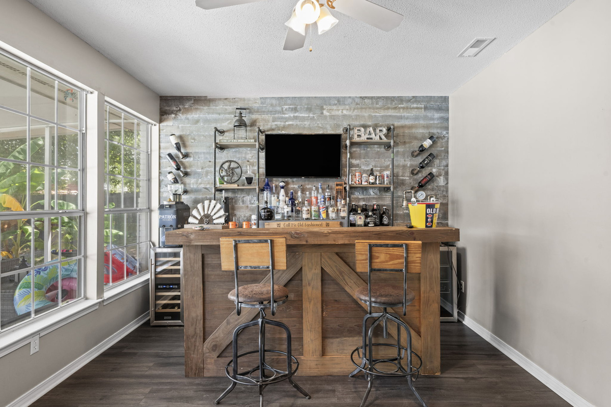 Rustic wood and reclaimed metal give this bar area serious character, with seating for two right at the counter.