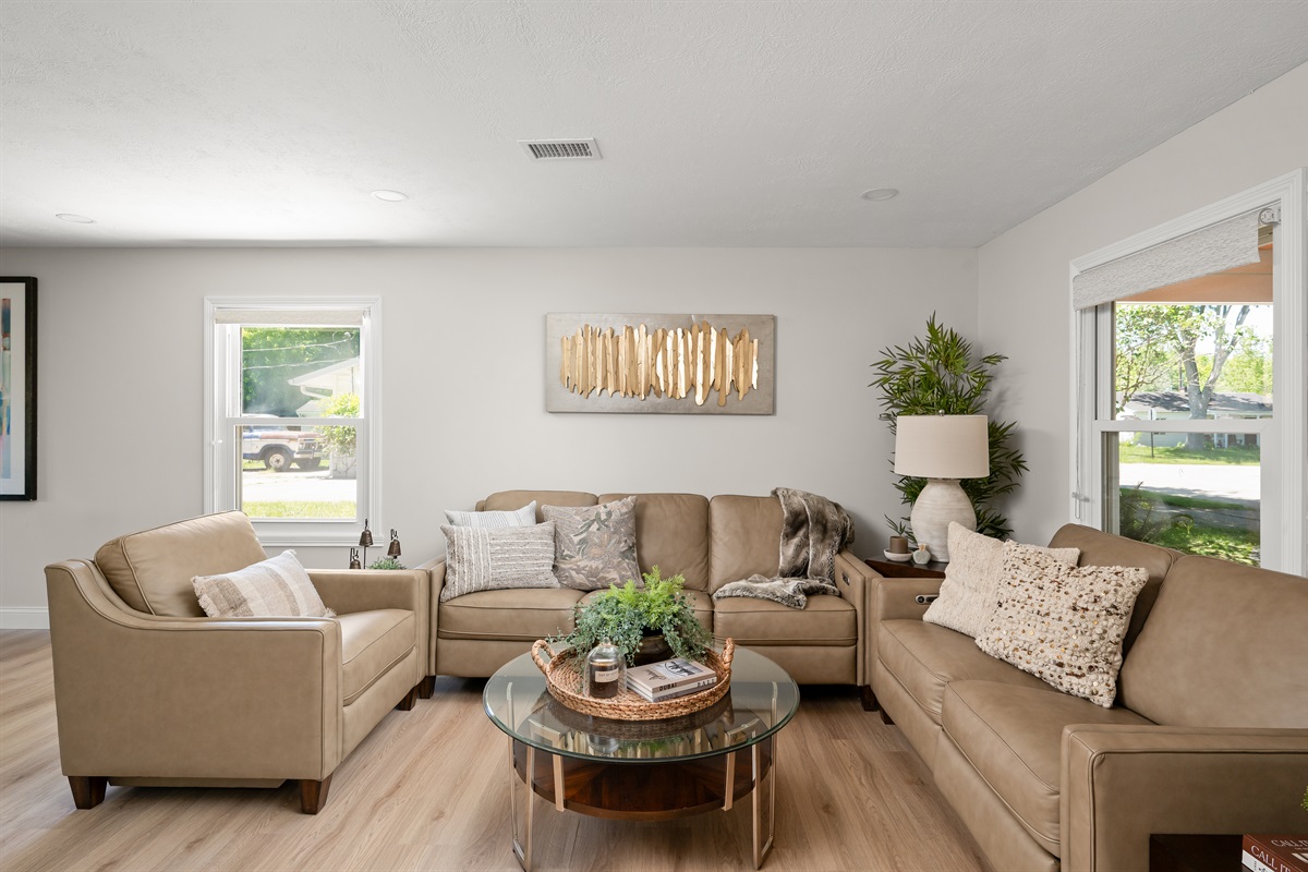 Spacious living room with comfortable seating for 6 to 8 guests, perfect for movie nights, game nights, or simply relaxing together after a day out.