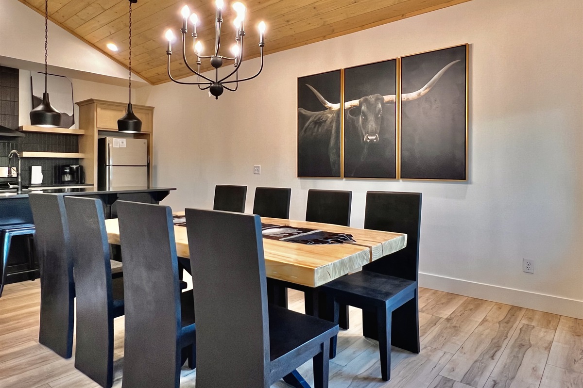 Plenty of chairs at the one of a kind solid wood table. Extra seating at the bar!