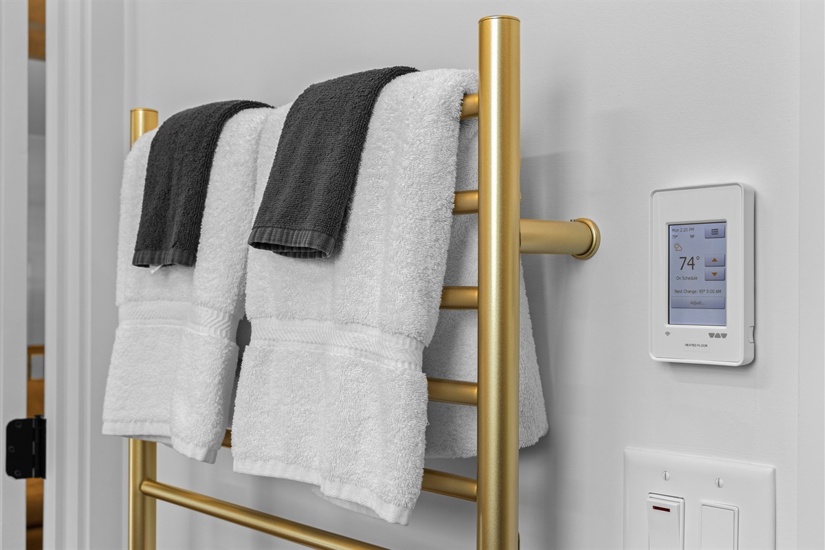 Heated towel rack and warm floors add spa-level comfort.