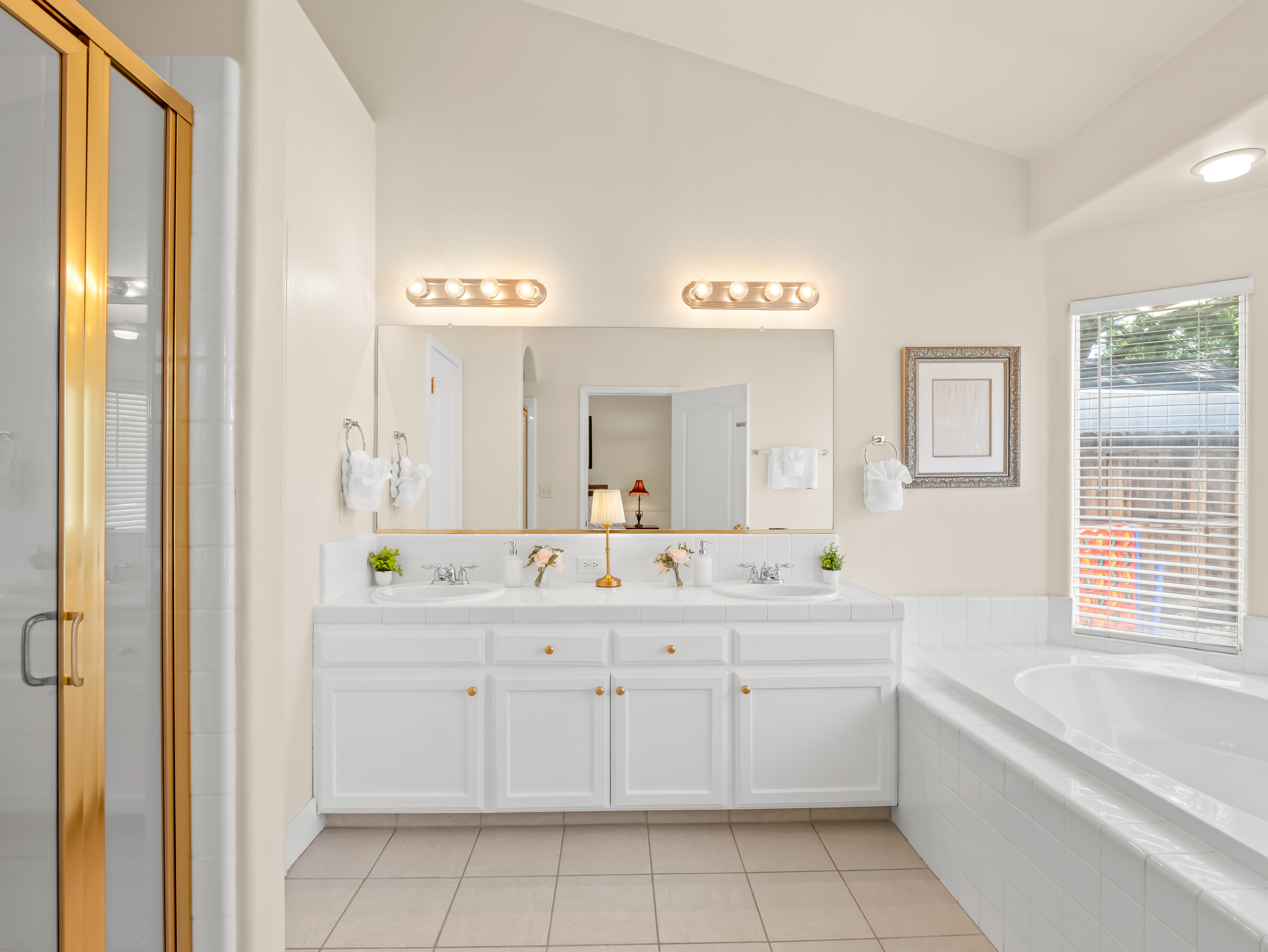 Treat yourself to a little extra comfort in this beautifully appointed primary bathroom. Featuring double sinks, a soaking tub, and separate shower, it's the perfect place to recharge after a day of adventure.