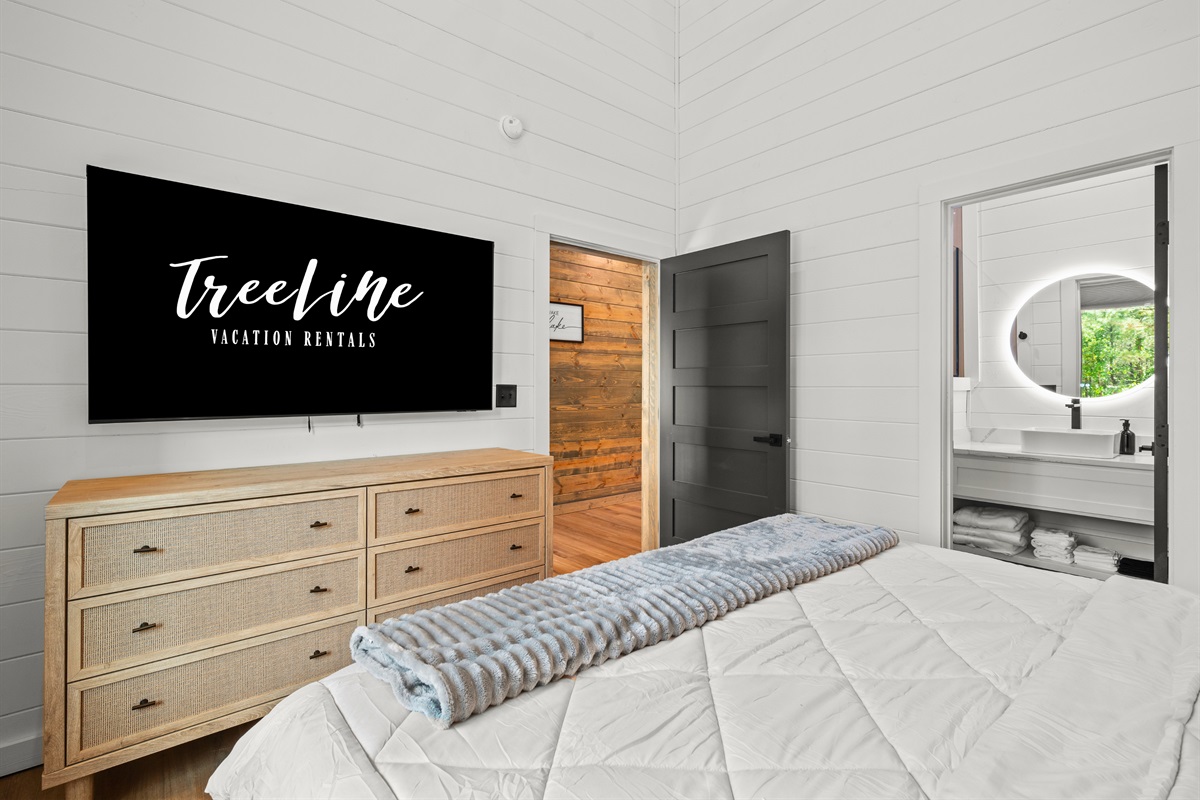 The thoughtfully designed layout and warm finishes give this bedroom a relaxing retreat-like feel that makes it easy to settle in and unwind.