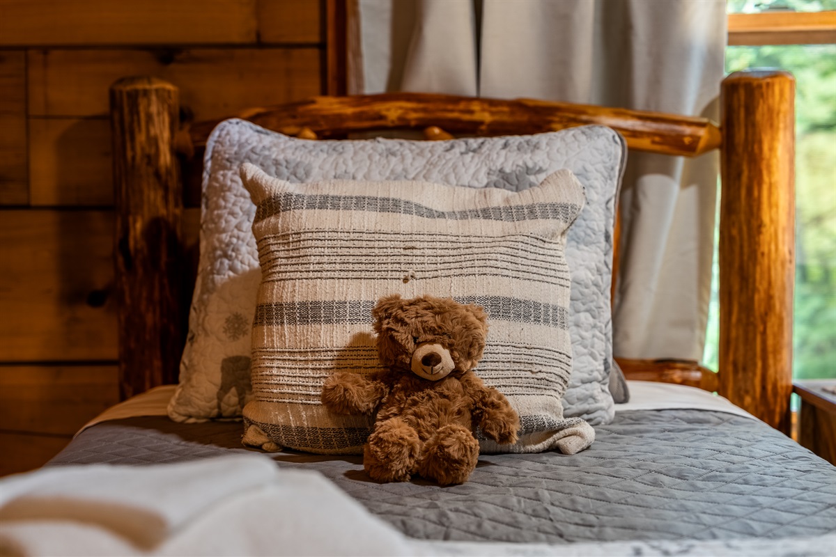 The cozy twin bedroom features charming rustic touches and thoughtful details that make it especially welcoming for younger guests