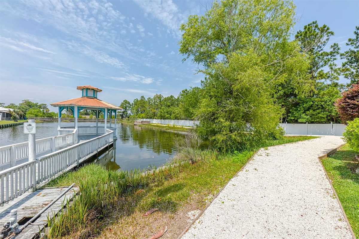 Outdoor Deck: Enjoy serene pond views from this charming gazebo—perfect for sunset reflections!