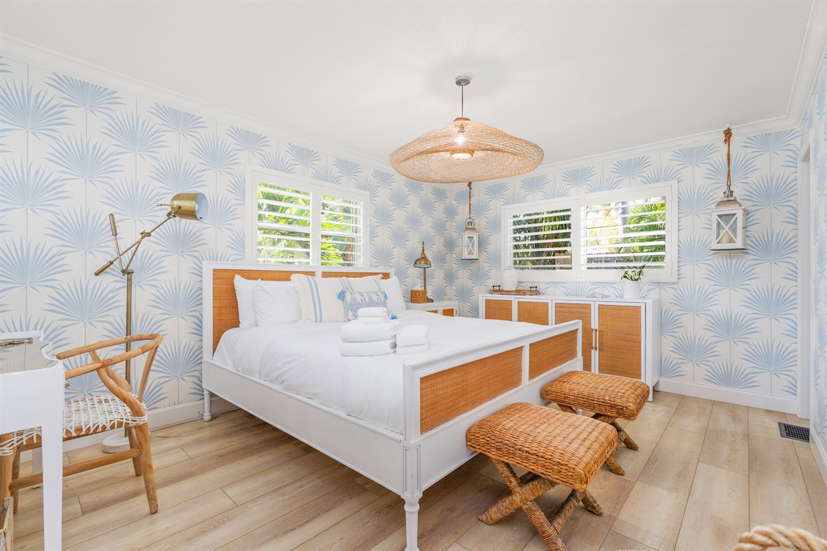 Primary Suite: A sanctuary of white linens and calming blue hues.