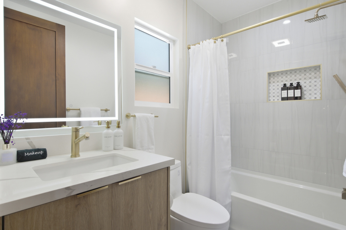This beautifully designed bathroom offers a peaceful space to refresh, relax, and get ready for the day.