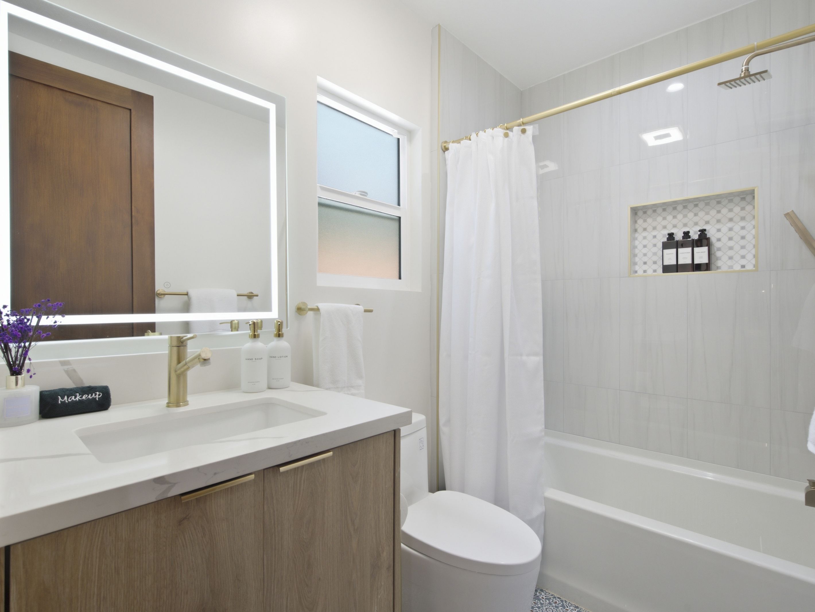 This beautifully designed bathroom offers a peaceful space to refresh, relax, and get ready for the day.