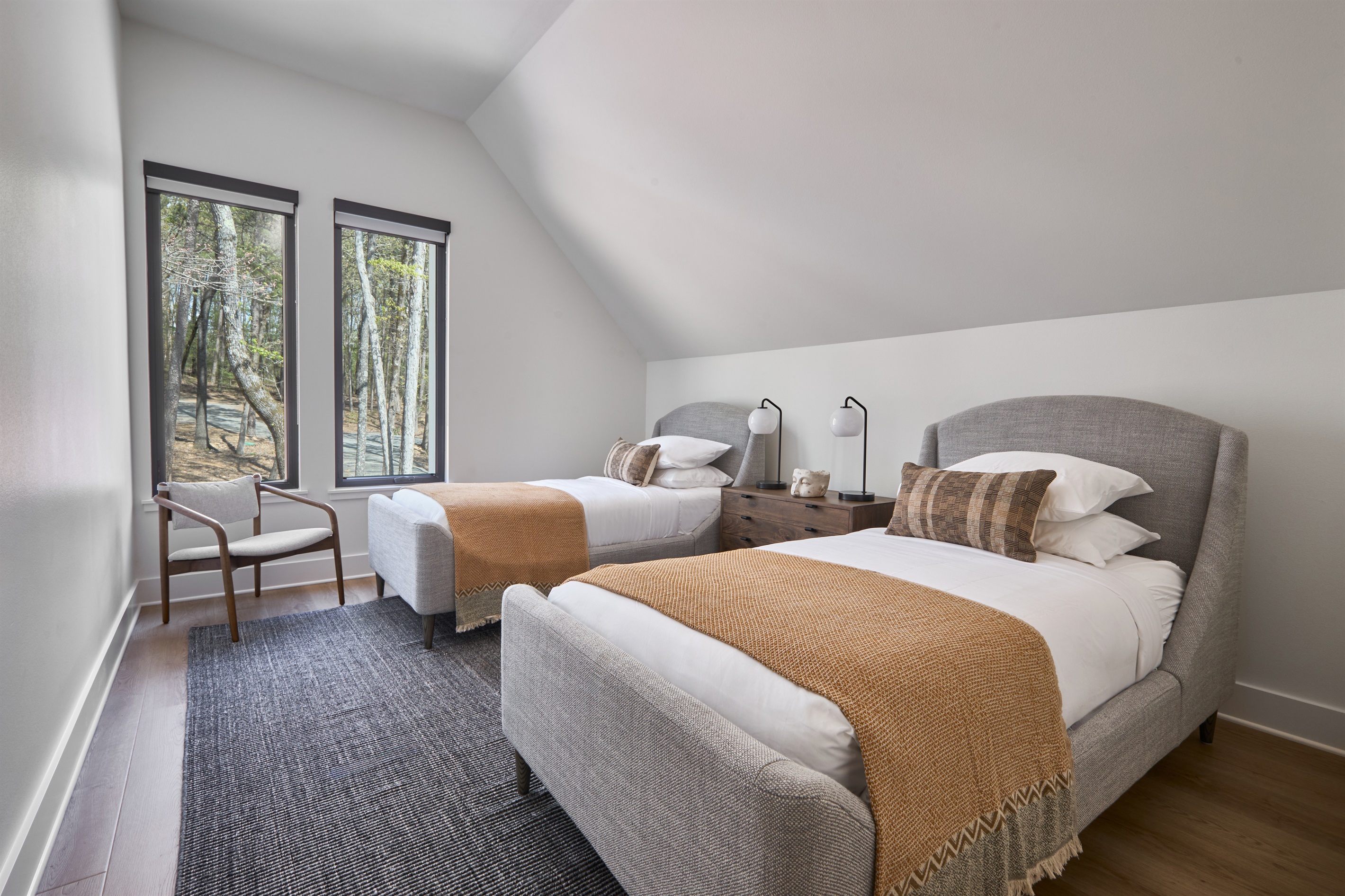 Two twin beds in this charming upstairs bedroom—perfect for kids, cousins, or friends to bunk up together