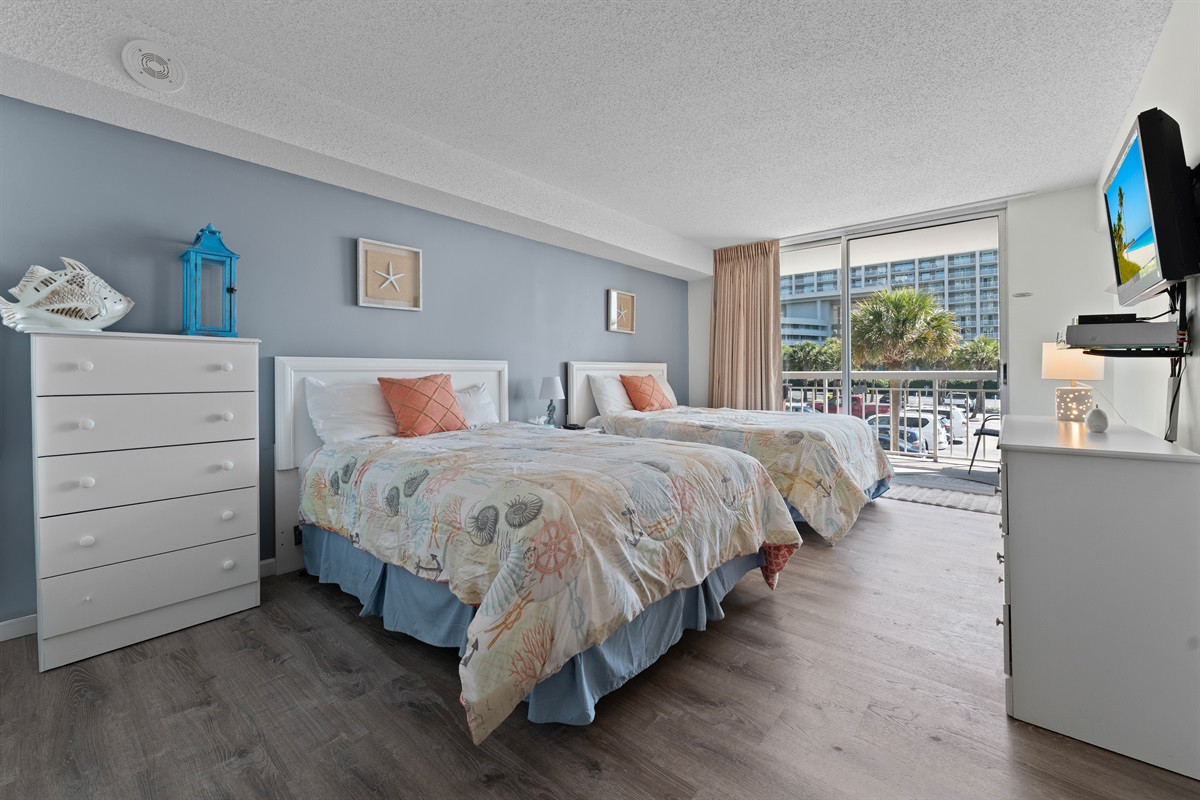 2nd Bedroom with double beds and balcony access