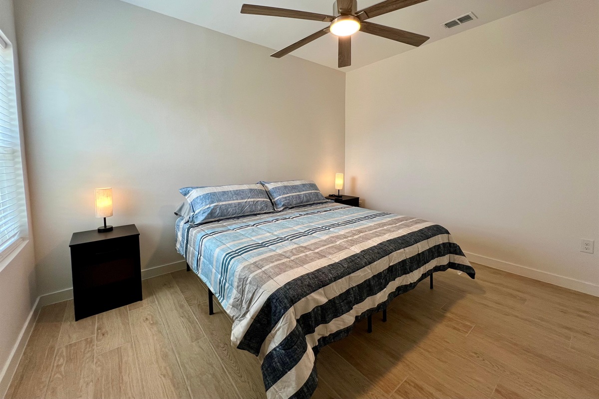 Primary Bedroom with King Bed and SmartTV