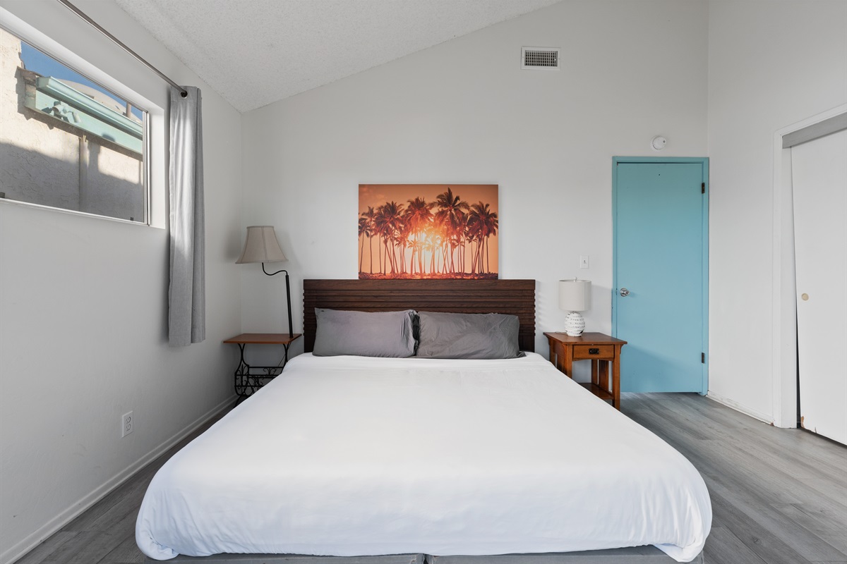 Primary bedroom with king memory foam bed and clean, simple design