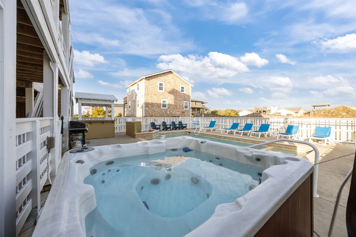 Relaxation: Hot tub spilling into pool.