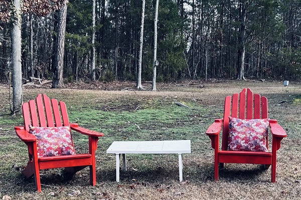 Gather to chat and soak up the sun in our large private back yard