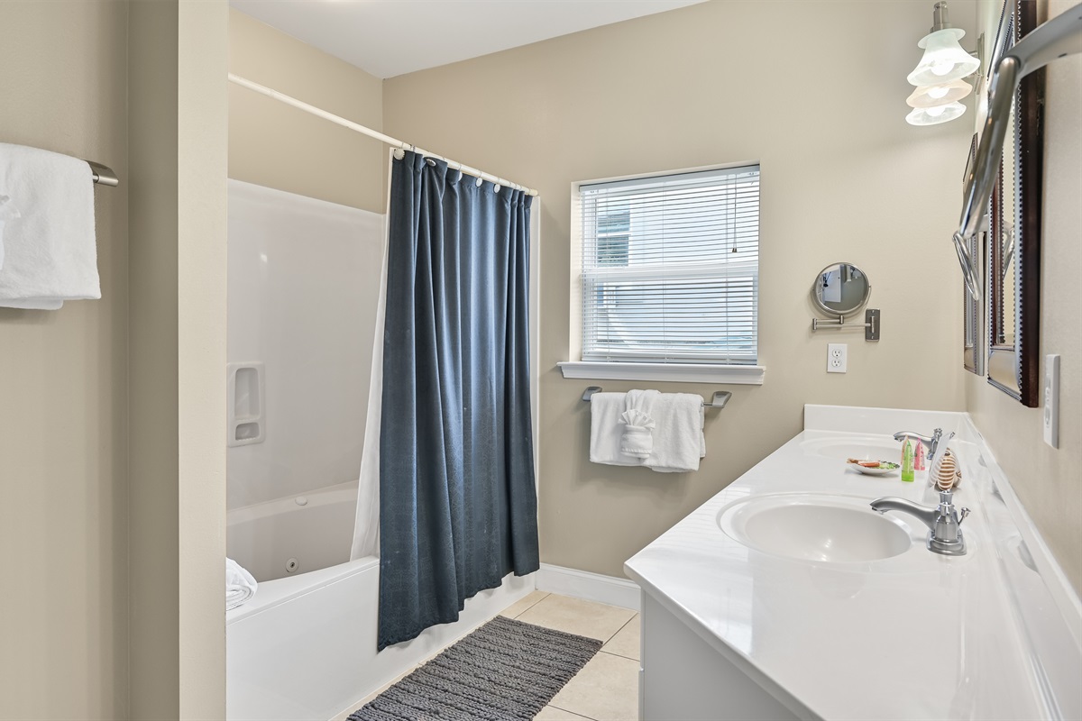 BEDROOM #4 + BATHROOM #4: King Bed with night stands, dresser, and TV. This bedroom has a private ba