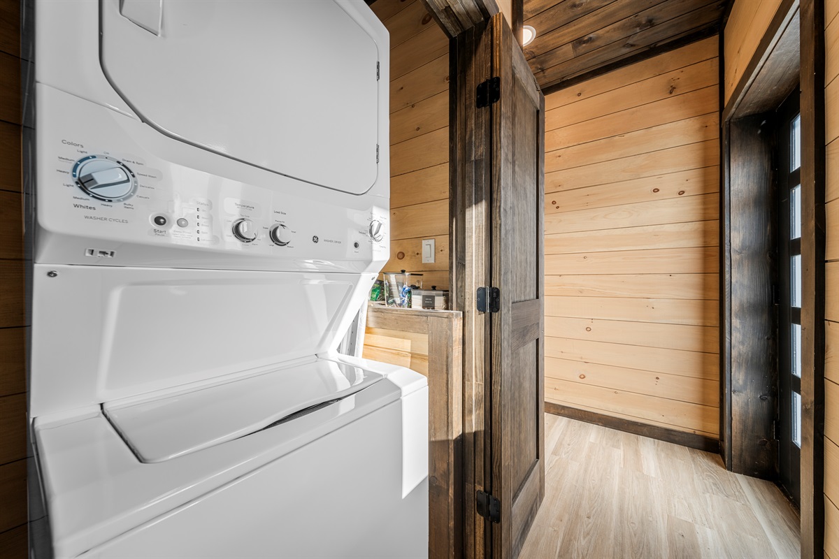 In-unit laundry tucked away in a main-level closet for easy access