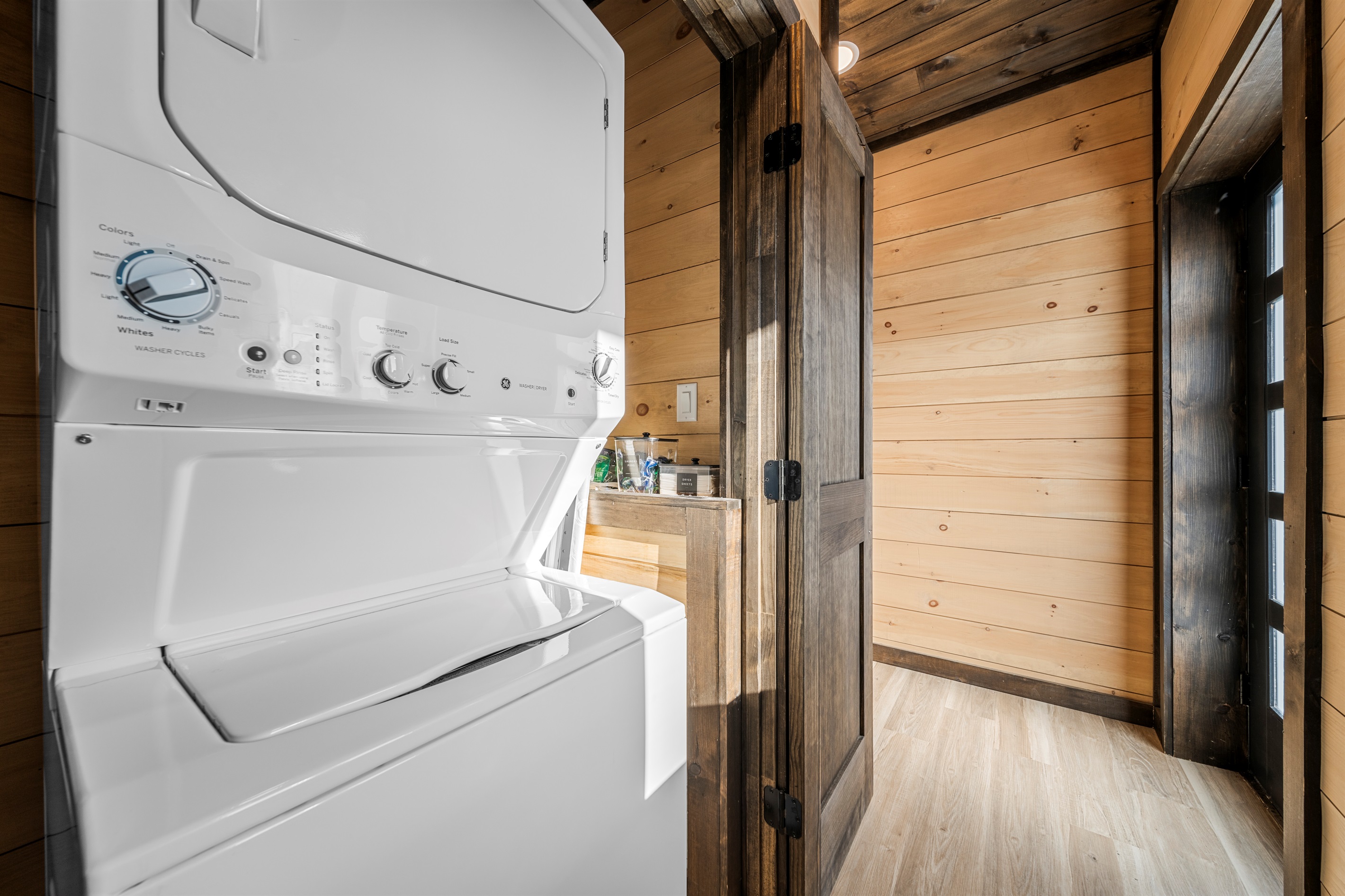 In-unit laundry tucked away in a main-level closet for easy access