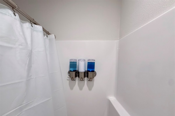 Secondary bathroom with tub/shower combo. Select toiletries provided