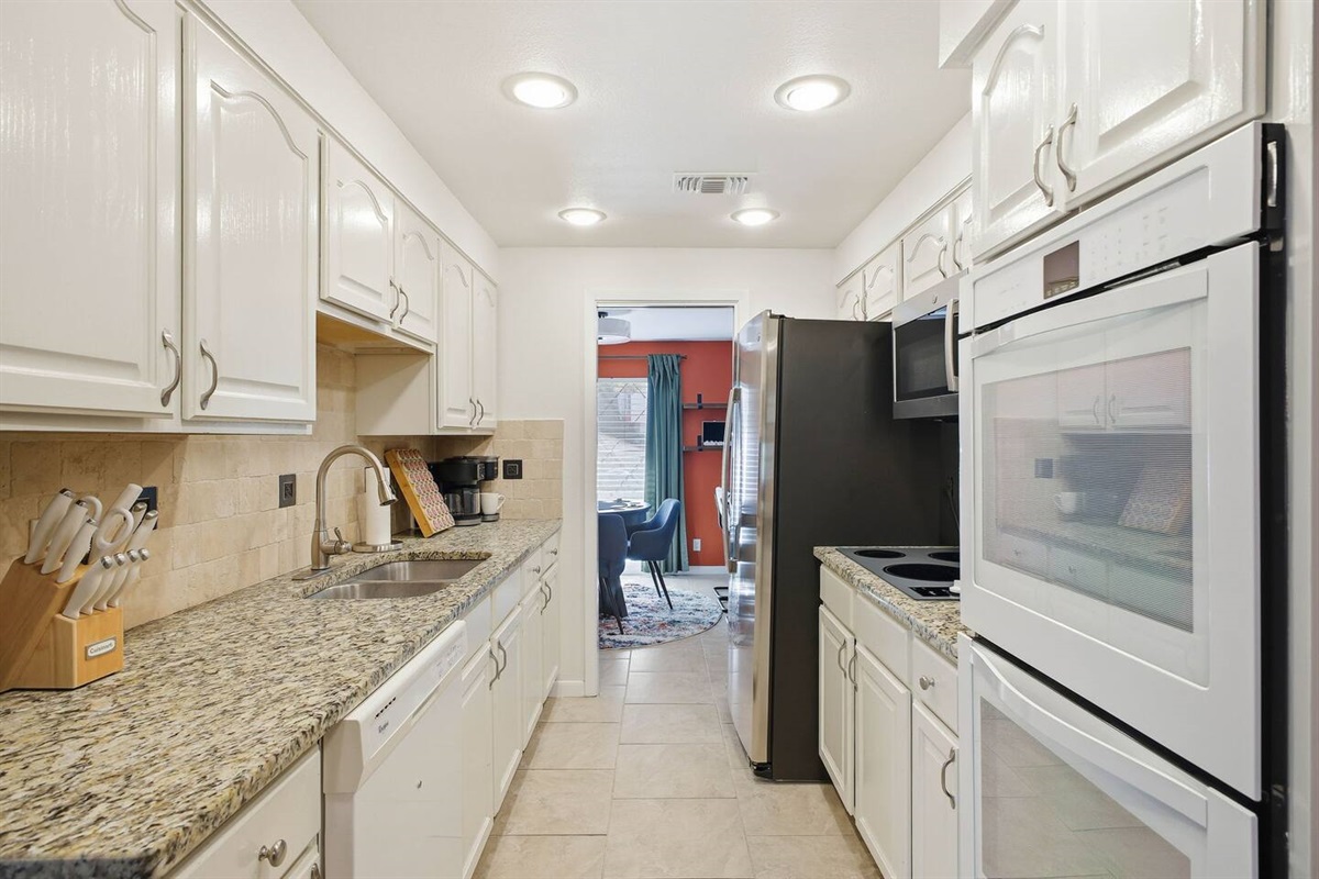 Kitchen with the adult poker game room in the background