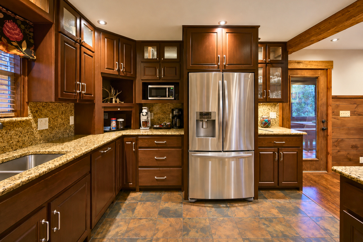 Fully equipped for meals throughout your stay, the kitchen combines stainless steel appliances with plenty of cabinetry and workspace to keep everything convenient and within reach.