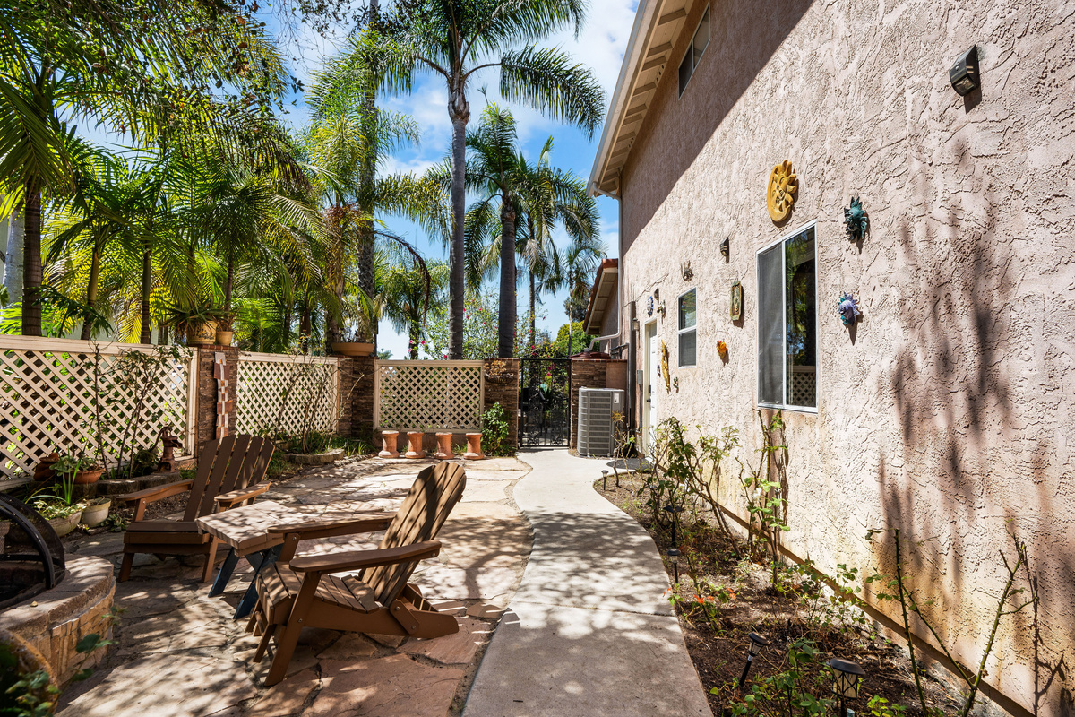 Side yard with a Gate into the Front Yard and a Door into the Garage