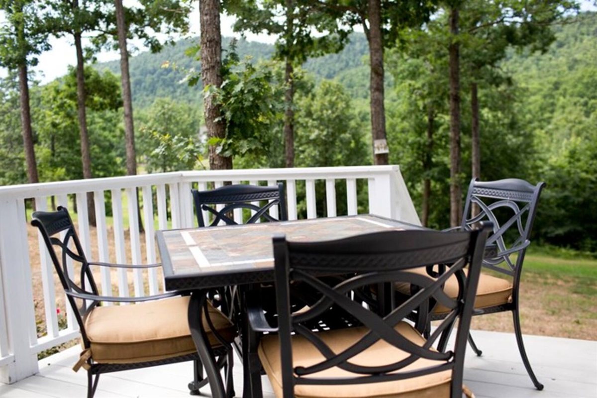 back deck at the white farmhouse cottage rental with scenic mountain views