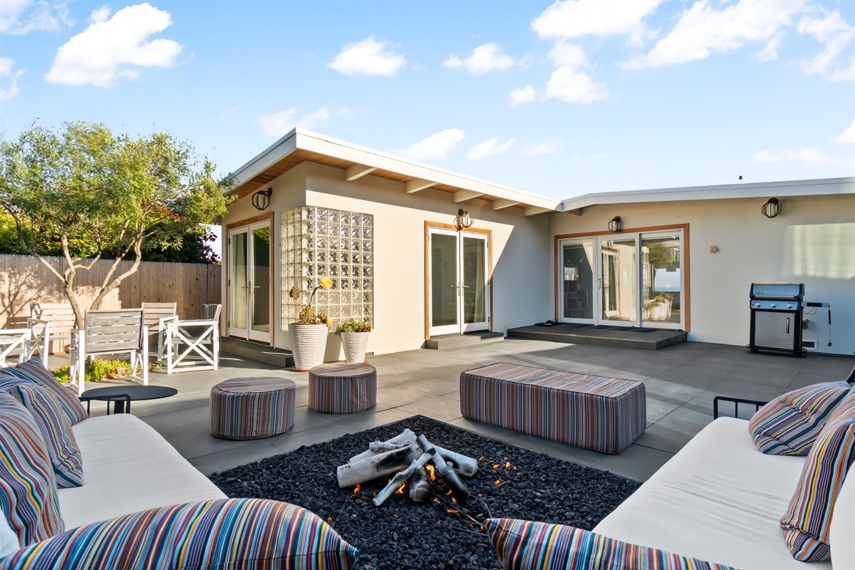 fire pit lounge area and entry to main house