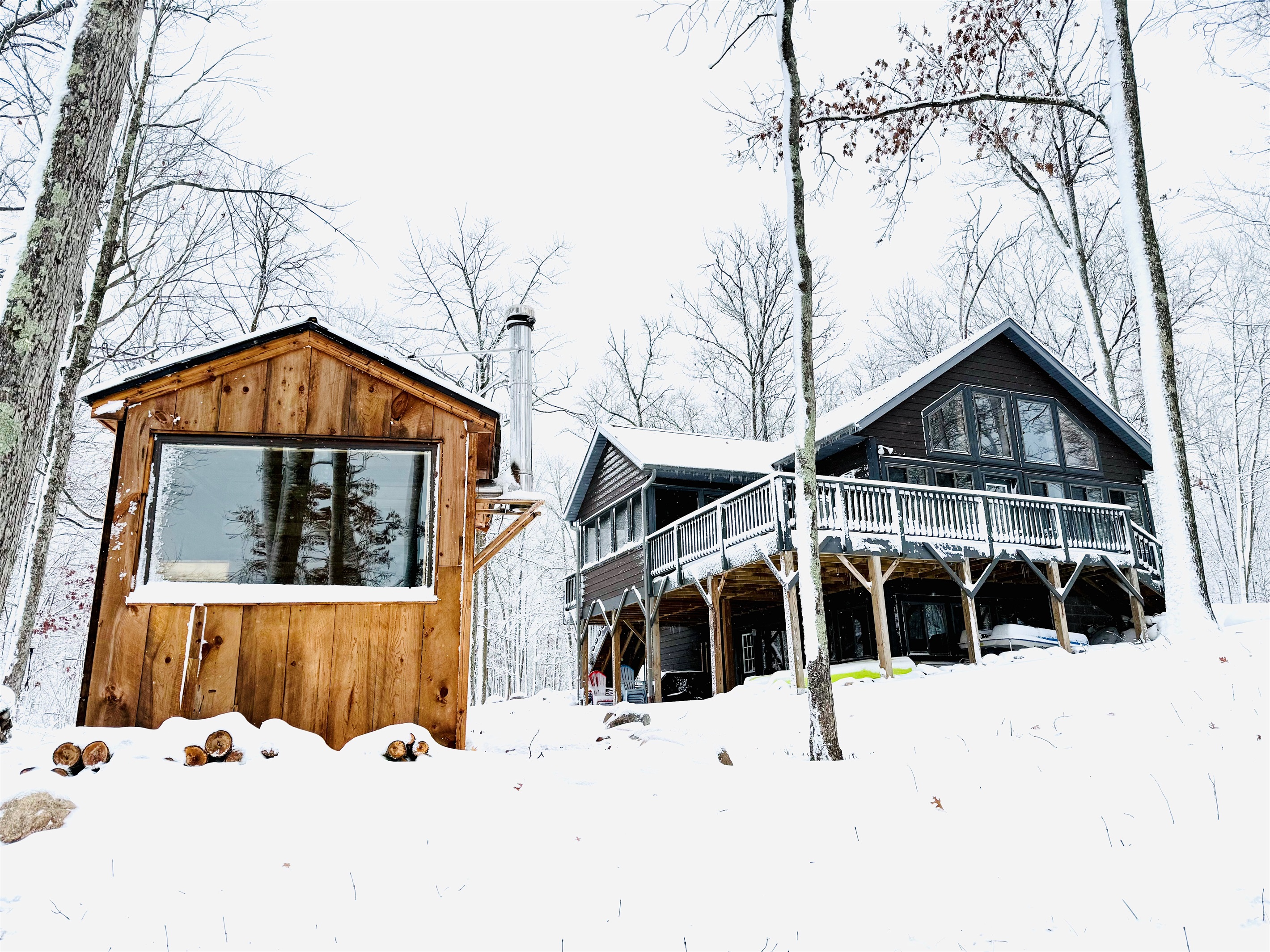 Our authentic wood burning sauna with a great view of the lake.