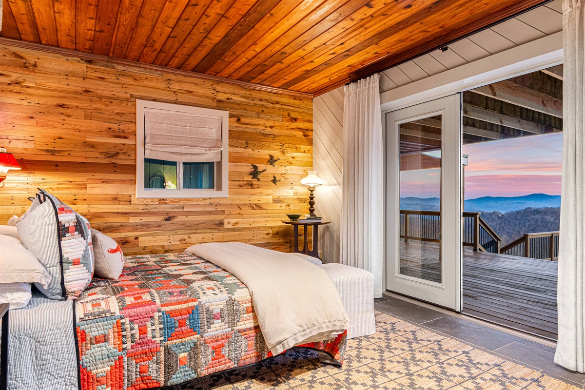 Step directly from the primary bedroom onto the deck through sliding glass doors—perfect for morning coffee, fresh mountain air, and sunset views just outside your door.