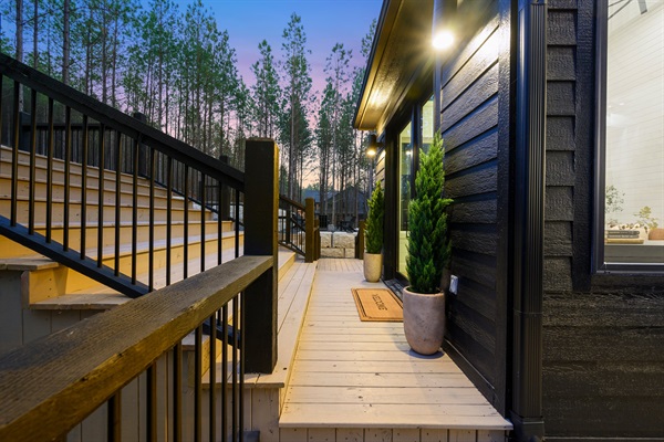 Contemporary finishes and soft evening lighting make this entry both dramatic and welcoming.