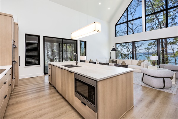 Enjoy stunning lake views while you cook in this open-concept kitchen that flows effortlessly into the living space.