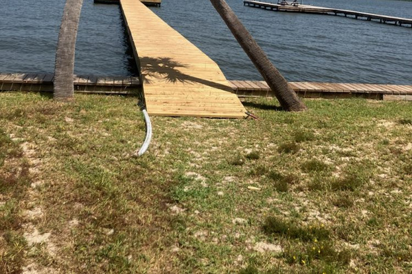 Palm-lined path to the private pier