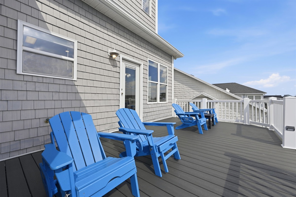 Spacious upper deck featuring canal views, lounge seating, and plenty of sunshine