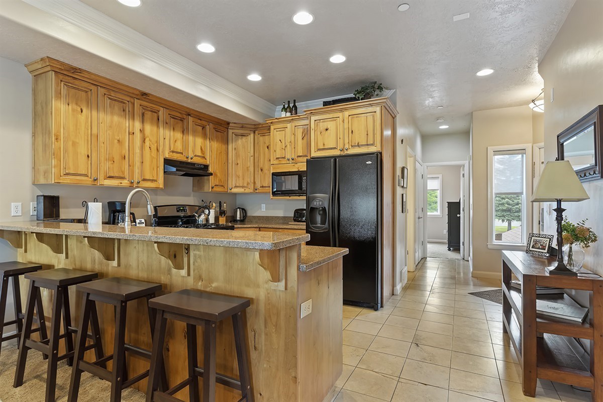 Kitchen with bar seating for four—perfect for casual dining and entertaining.