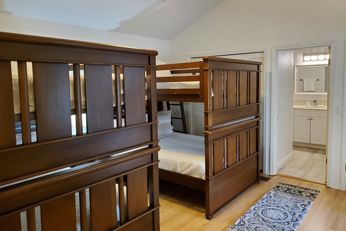 View of private full bathroom from bunkbed room