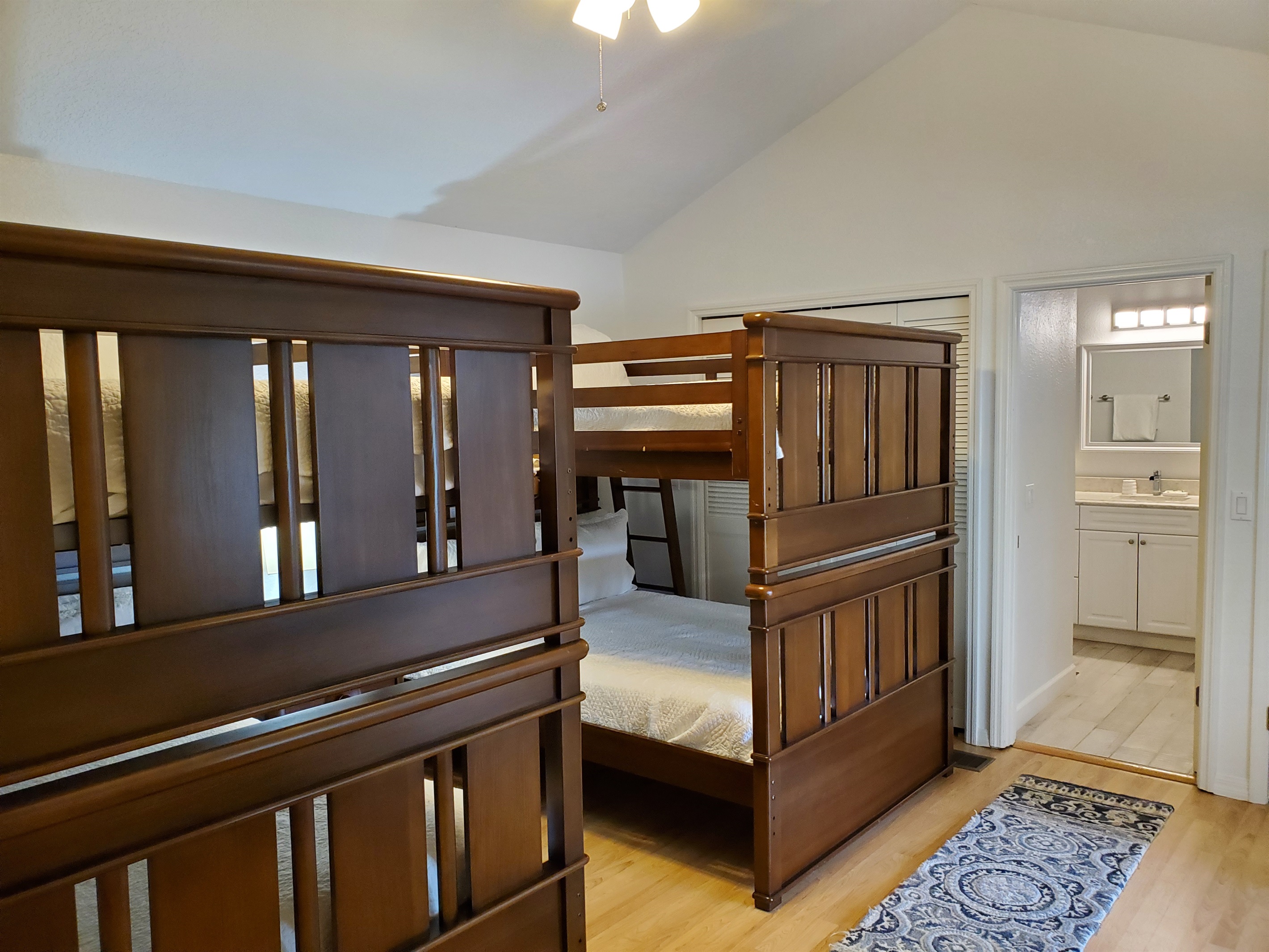 View of private full bathroom from bunkbed room